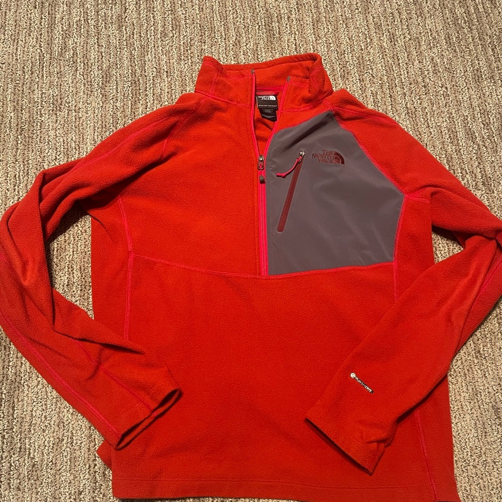 Red and gray, lightweight quarter-zip fleece by The North Face.